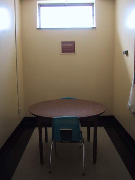 [Finney library offers energy assistance, so there were people in the meeting rooms getting advice and help with their bills. This small room was empty but oddly inviting. All I can read on that plaque in the back of the room are the words NOT RESPONSIBLE.
]