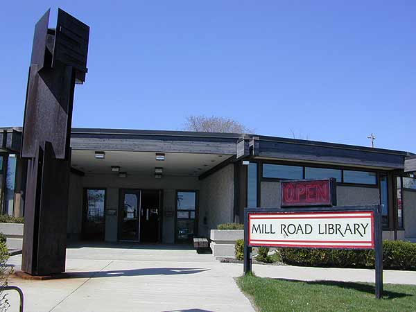 [<a href=http://www.mpl.org/files/branch/millroad.htm>Mill Road Branch</a>. This library was the first one we saw with interesting architectural flairs. It was round, or sort of round, round with corners. The librarians and the tech staff were in a roundish staff area in the middle of the large room. It made them seem impressive.
]