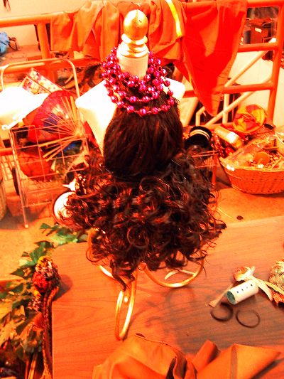 [Banker was sharing the space with <a href=http://www.sunsetscavenger.com/air_ruff.htm>another woman</a> who was mostly making costumes for some upcoming parade. This was a miniature dress made out of a wig.
]